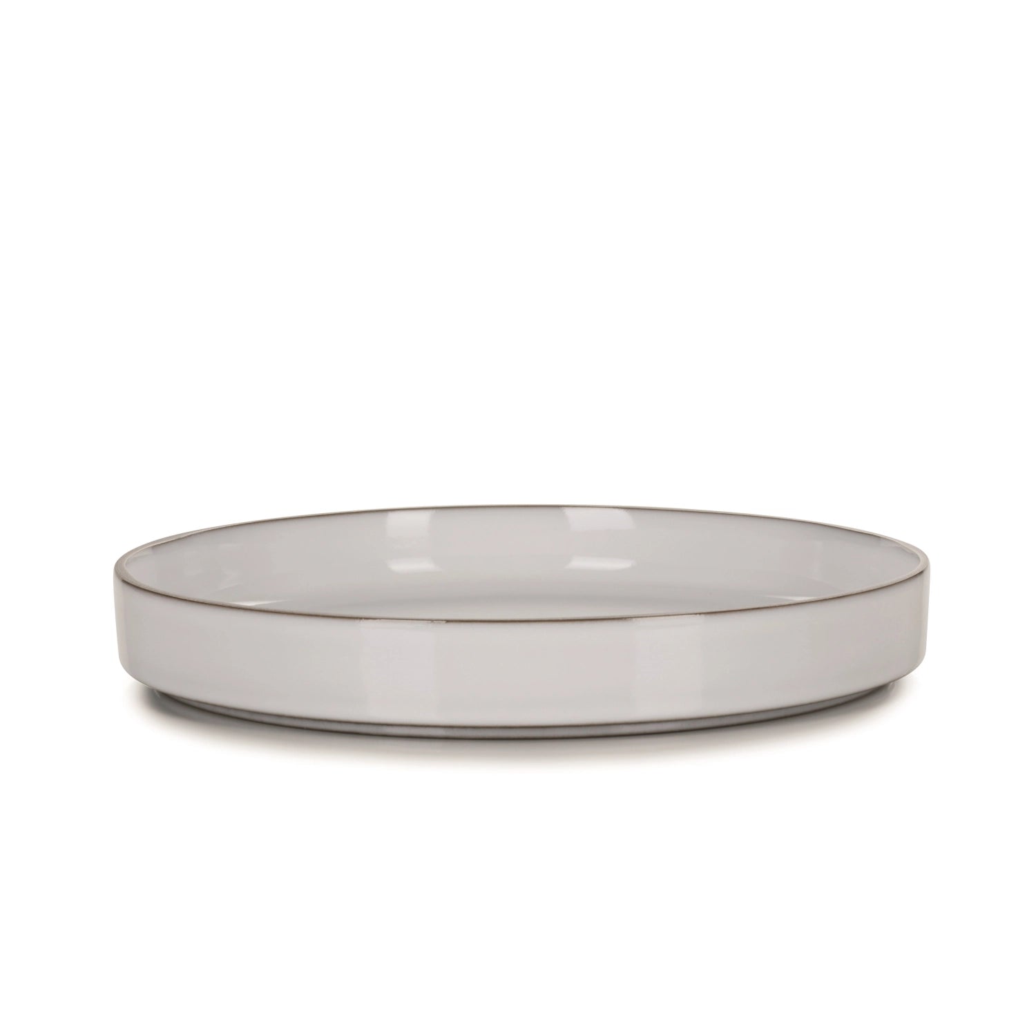 Hochwertiger Gourmetteller von Revol, Ø 23 cm, in klassischem Weiß, perfekt für stilvolle Anrichte und besondere Anlässe.