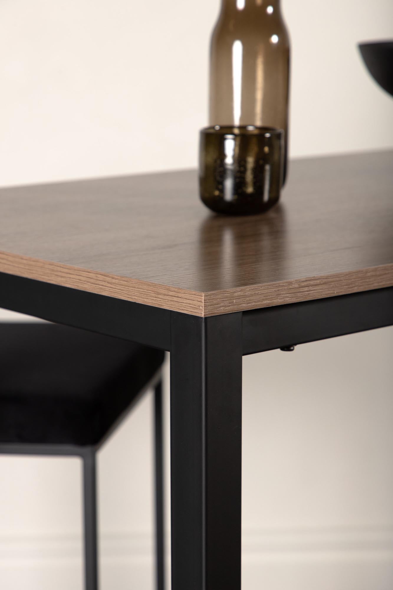 Entdecken Sie den Camden Bartisch von Venture Home: elegantes Design, robuste MDF-Platte in Walnuss, stabiler Stahlrahmen, ideal für moderne Küchen.