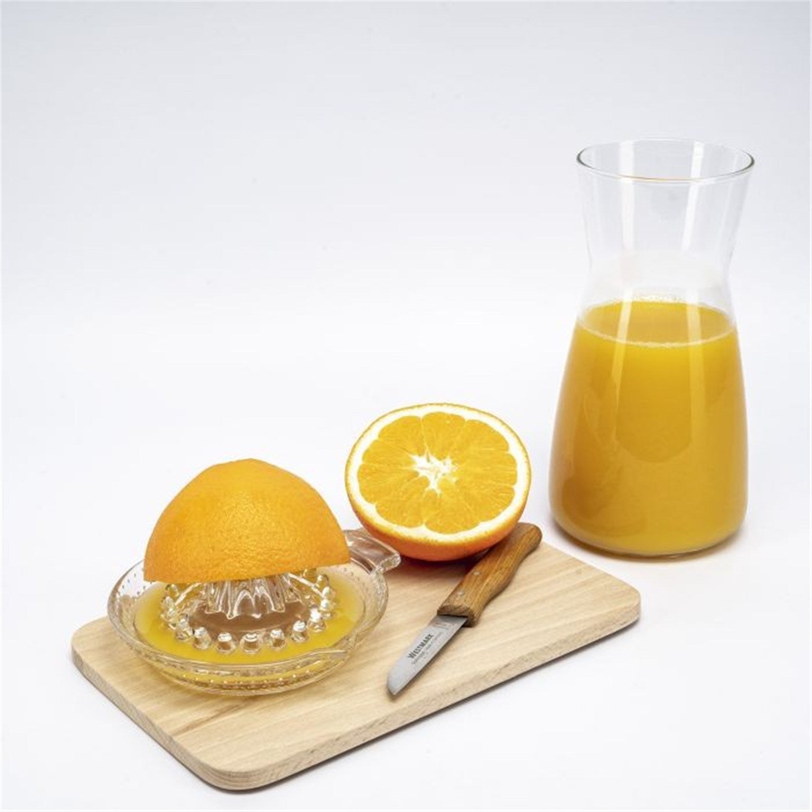 Kompakte Zitruspresse aus Glas von Westmark, perfekt für 30ml Saft, ideal für kleine Mengen, handlich und leicht zu reinigen.