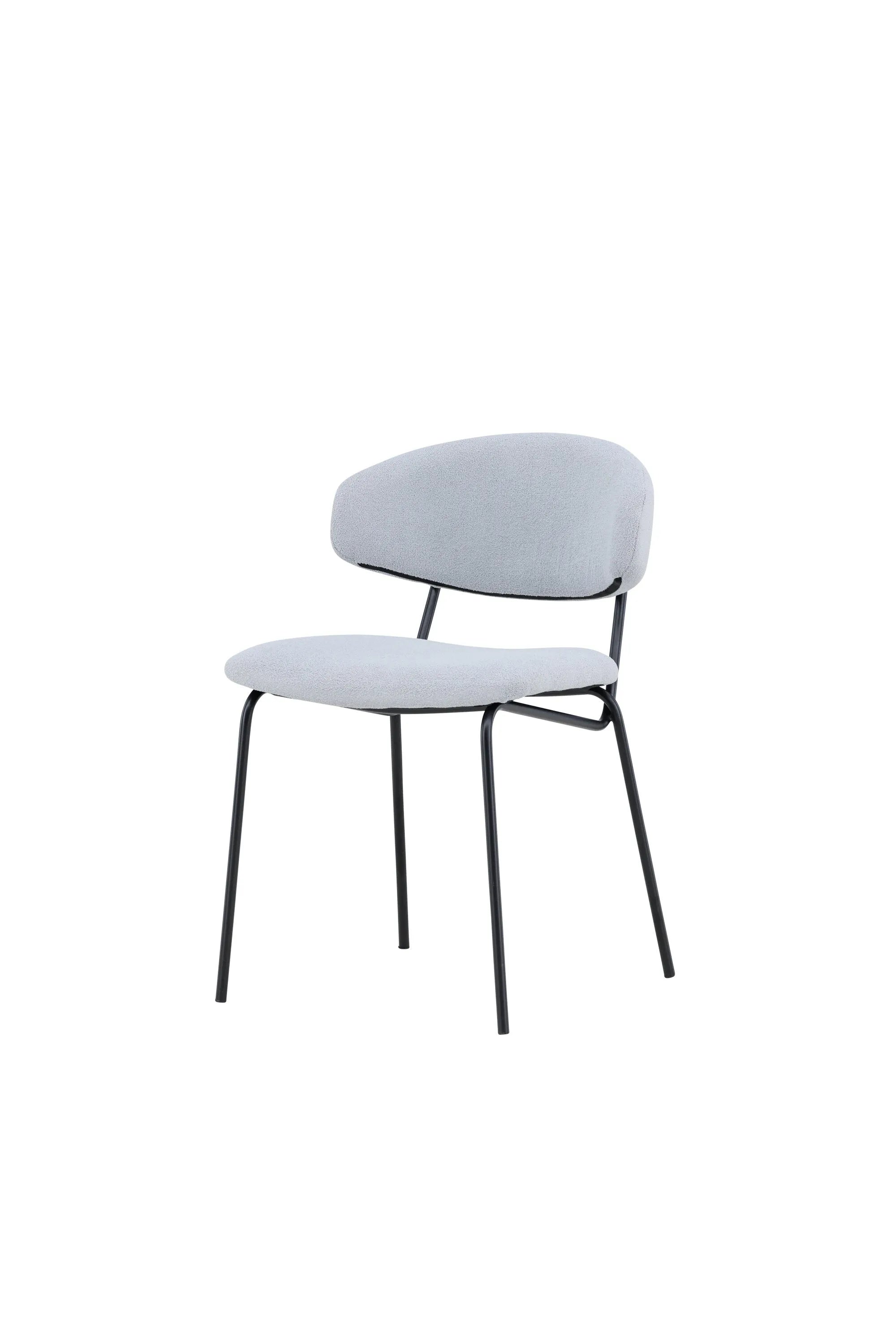 Chico Stuhl: Modernes Design mit blauem Bouclé und robustem Stahl.