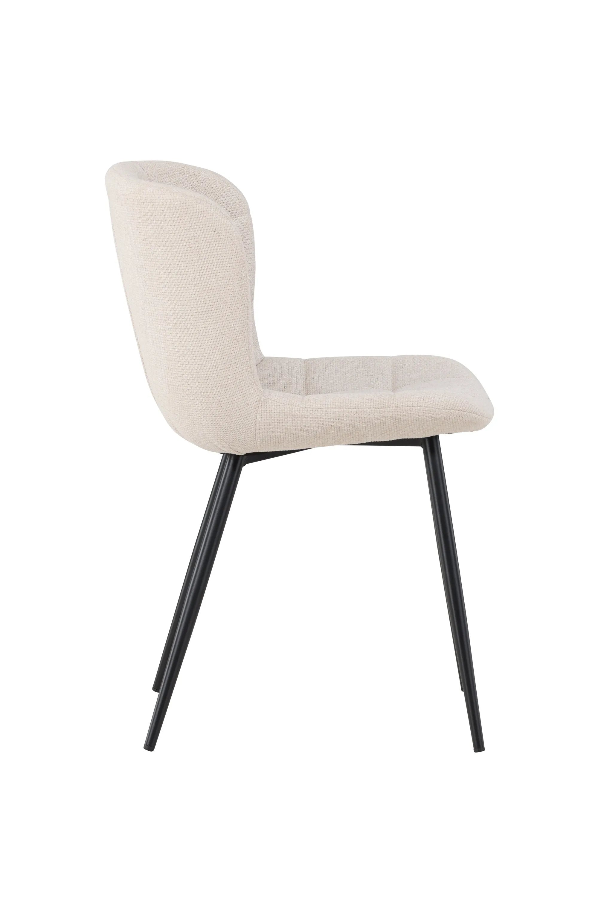Der Lily Esszimmerstuhl vereint elegantes Design mit Komfort: Beige Polsterung, schwarze Beine, ideal für stilvolle Esszimmer.