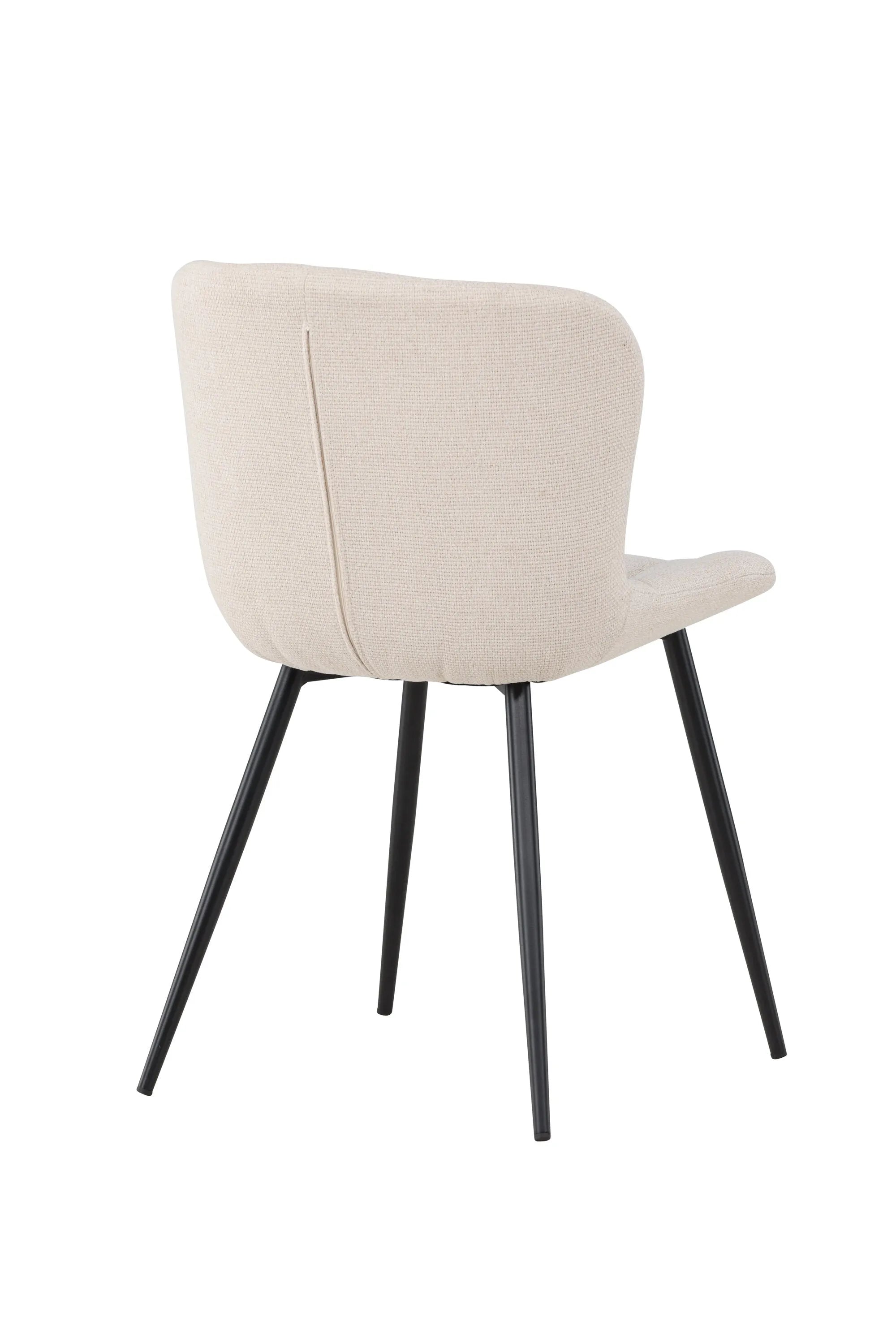 Der Lily Esszimmerstuhl vereint elegantes Design mit Komfort: Beige Polsterung, schwarze Beine, ideal für stilvolle Esszimmer.