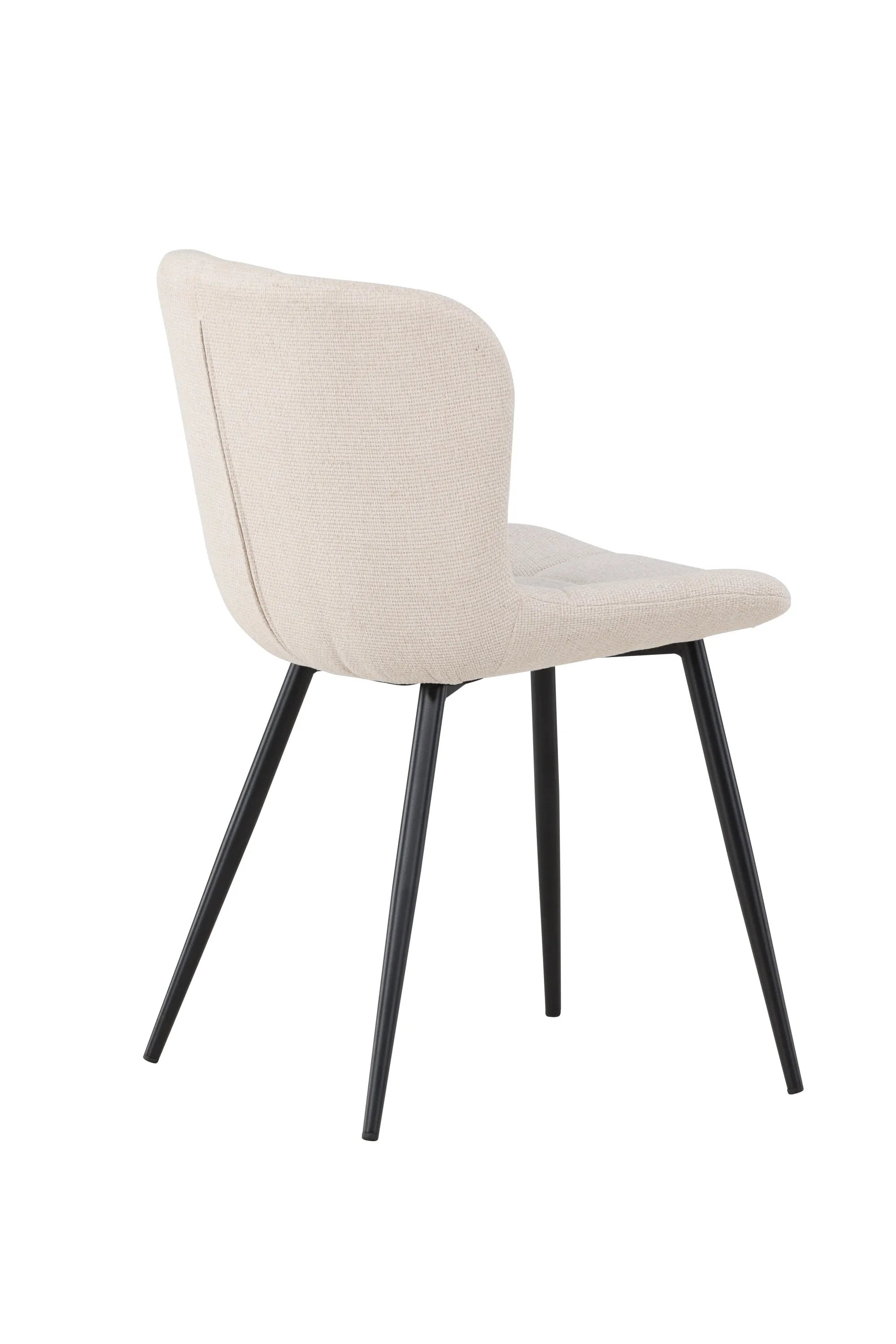 Der Lily Esszimmerstuhl vereint elegantes Design mit Komfort: Beige Polsterung, schwarze Beine, ideal für stilvolle Esszimmer.