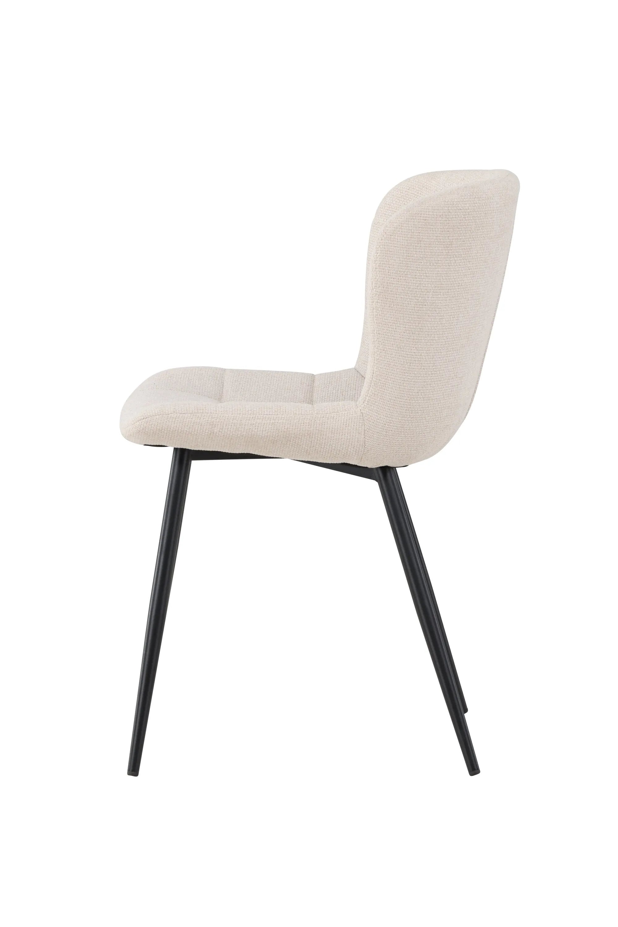 Der Lily Esszimmerstuhl vereint elegantes Design mit Komfort: Beige Polsterung, schwarze Beine, ideal für stilvolle Esszimmer.