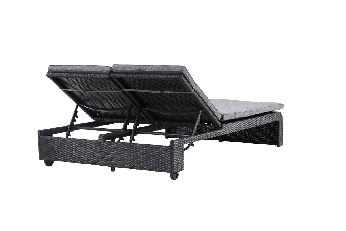 Sonnenliege London von Venture Home in Schwarz mit grauem Kissen und Korbgeflecht