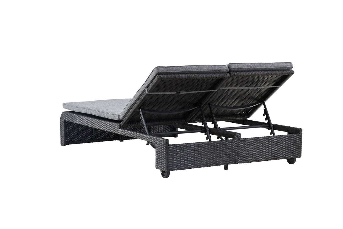 Sonnenliege London von Venture Home in Schwarz mit grauem Kissen und Korbgeflecht
