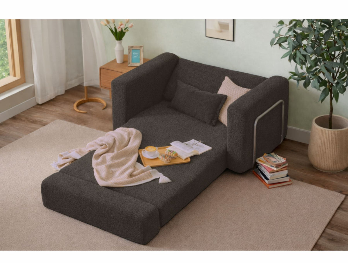 Anthrazitfarbenes 1-Sitzer Schlafsofa Wello aus 100% Bouclé-Stoff mit Sitzhöhe 35 cm und abnehmbarem, waschbarem Bezug von Hanah Home.