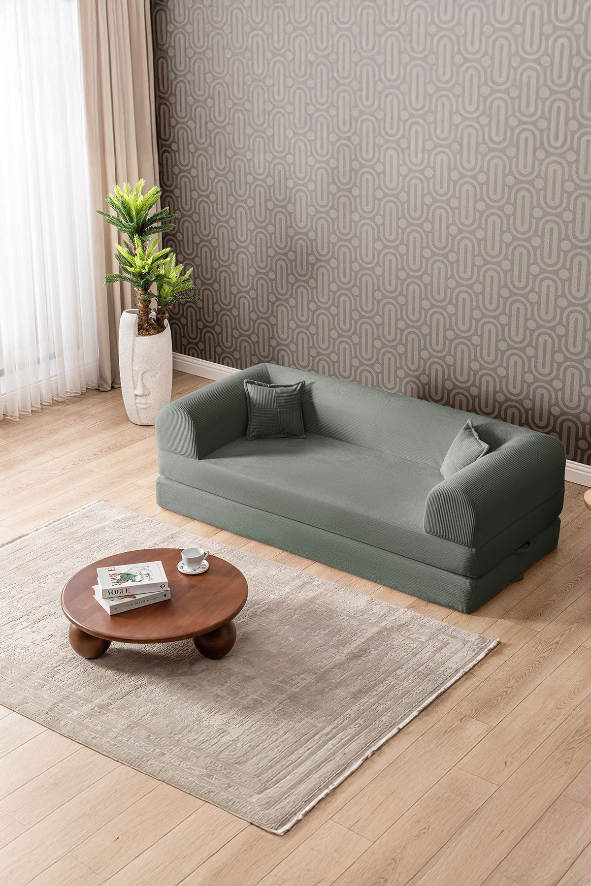 Grünes 3-Sitzer Schlafsofa Legom Eco von Hanah Home aus geripptem Cord-Plüschstoff mit zwei Kissen und abnehmbarem Bezug.