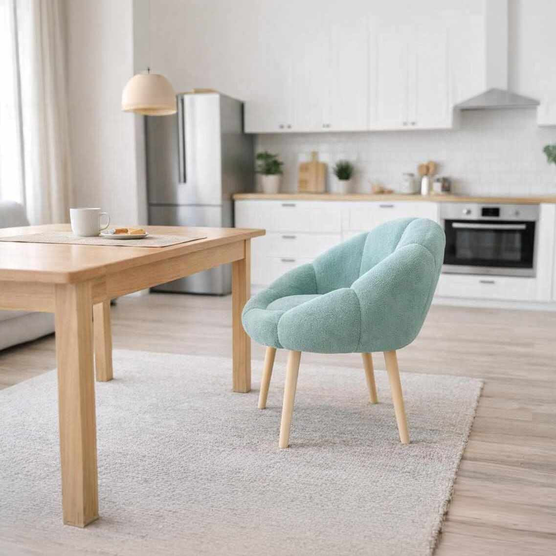 Grüner Ohrensessel im Wing-Chair-Design mit Wellsoft-Bezugsstoff, Gestell aus melaminbeschichteter Spanplatte und Beinen aus Eschenholz.