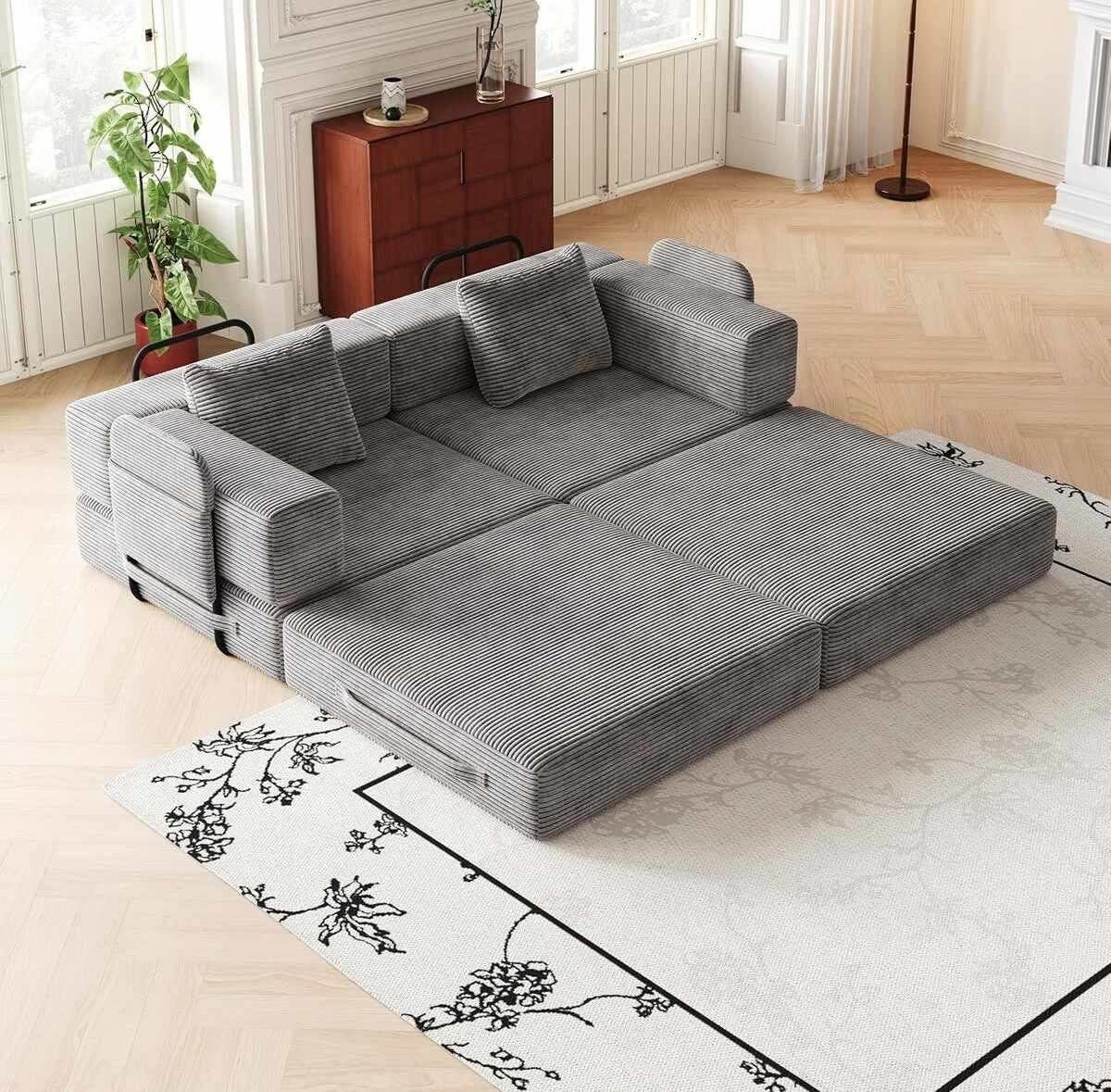 Graues 3-Sitzer Schlafsofa von Hanah Home aus Polyester-Leinen-Stoff mit Eisen-Stützstreben, zwei Kissen und rutschfester Sohle.