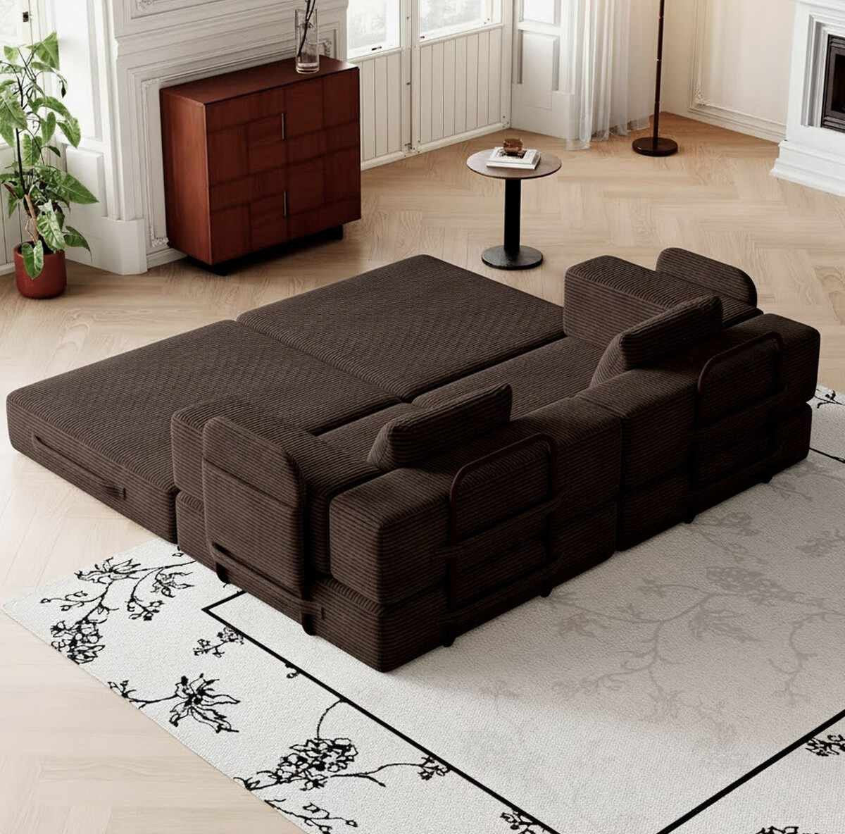 Braunes 3-Sitzer Schlafsofa aus Polyester und Leinen mit vier Eisen-Stützstreben, minimalistisches Design, zwei Kissen auf der Sitzfläche.