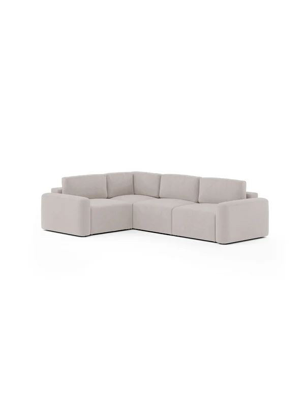 Eckcouch in Ecru mit Gestell aus Buchenholz und Spanplatte, Kunststoffbeinen und gepolsterten Sitzflächen aus Schaumstoff.
