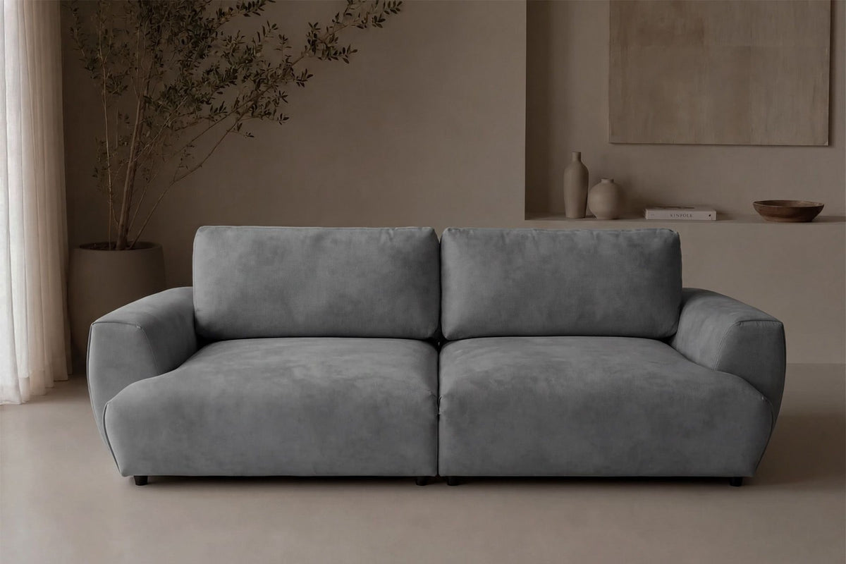 Graues 3-Sitzer Schlafsofa Arthur von Hanah Home mit Polyesterbezug, Buchenholzgestell und Kunststoffbeinen, zwei Kissen auf der Sitzfläche