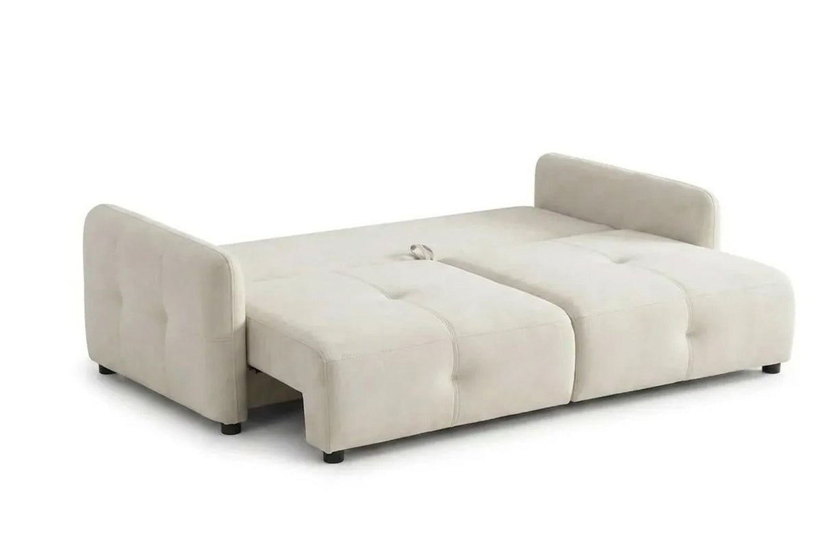 Ecrufarbenes 3-Sitzer Schlafsofa Magic von Hanah Home mit Polyesterbezug, Buchenholzgestell und Kunststoffbeinen im Wohnraum.
