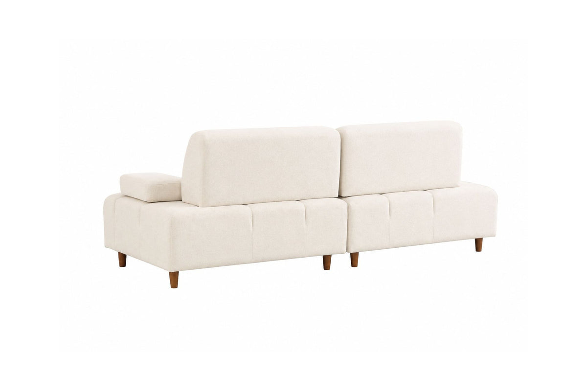 Cremefarbenes 3-Sitzer-Sofa Madlen von Hanah Home mit Polyesterbezug, Kunststoffbeinen und zwei Kissen auf Buchenholzgestell