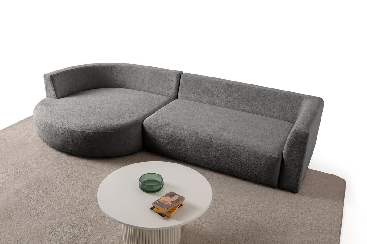 Anthrazitfarbenes Ecksofa Venezia links mit Lounge-Modul, 2-Sitzer-Modul, Kunststoffbeinen und neun Kissen, Polyesterstoff.