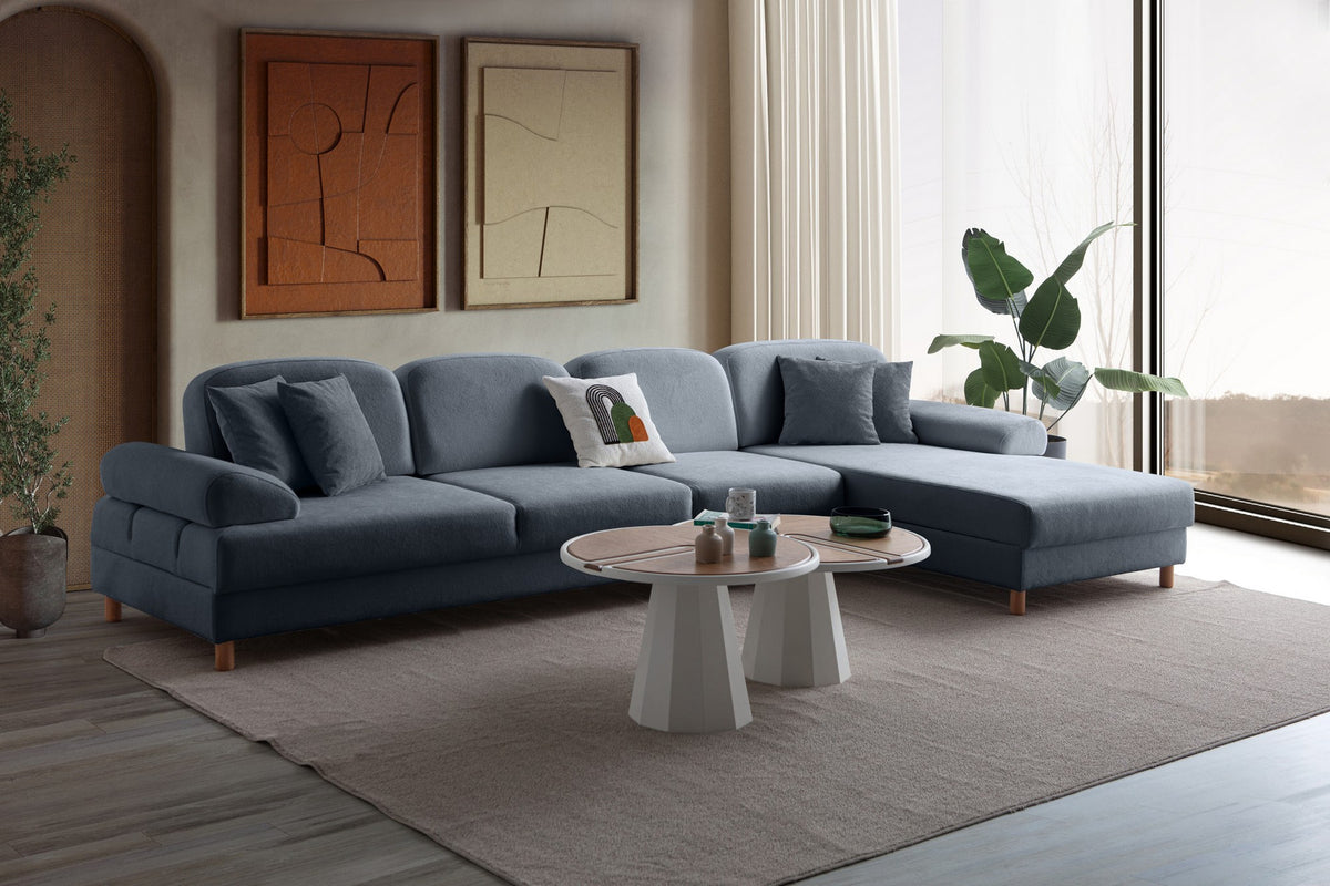 Marineblaues Eck-Schlafsofa Aries Relax Joker von Hanah Home mit Coco-Boucle-Stoffbezug, Holzbeinen und ausklappbarer Liegefläche.