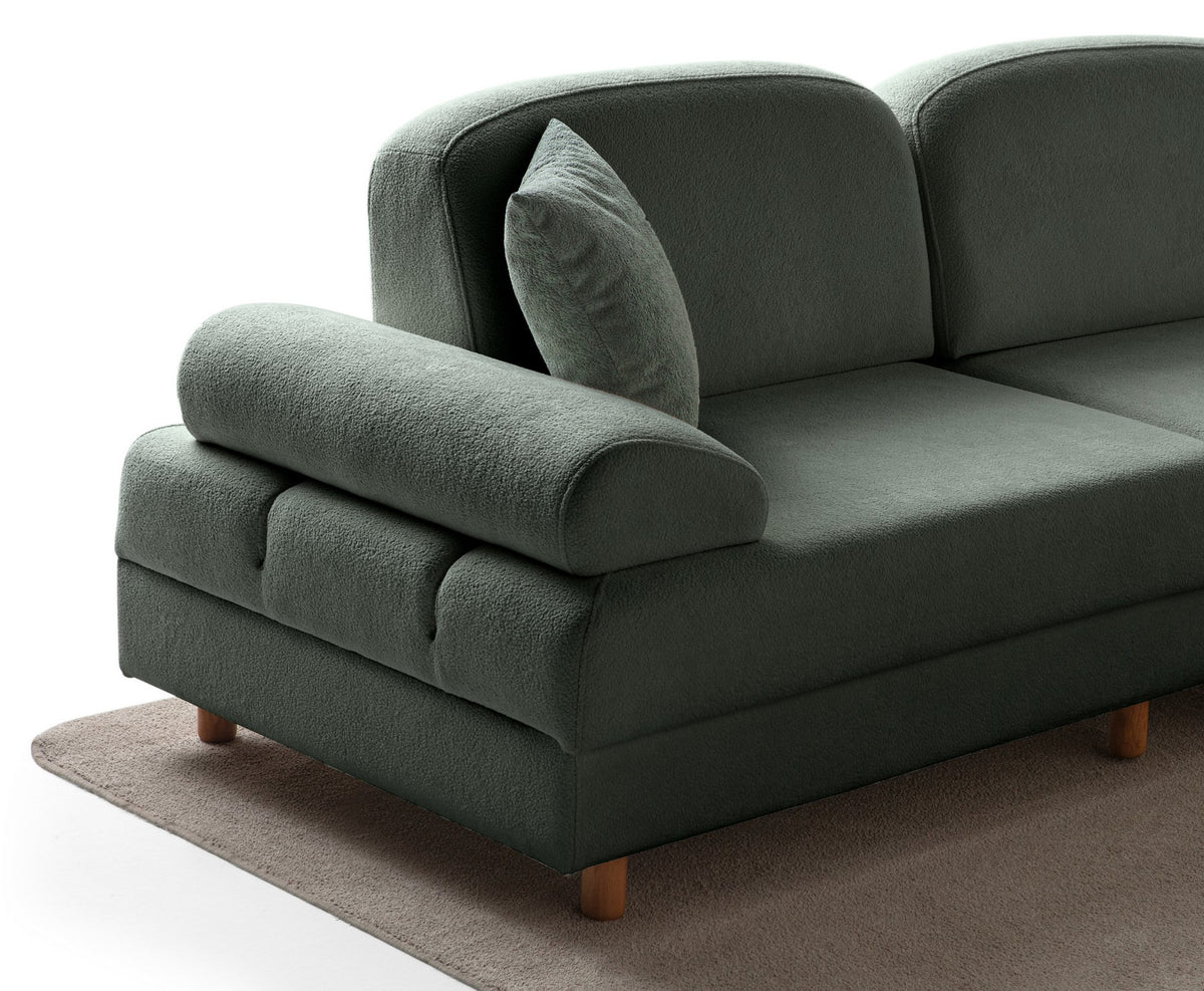Grünes Eck-Schlafsofa Aries Modular S von Hanah Home mit Coco-Boucle-Stoffbezug, Holzbeinen und integrierter Truhe für Stauraum.