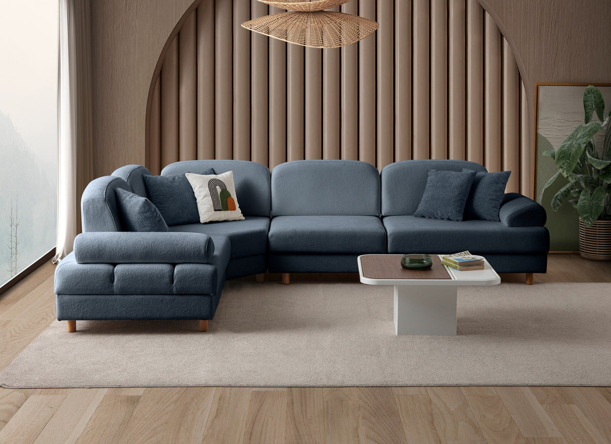Marineblaues Eck-Schlafsofa Aries Modular M von Hanah Home mit Coco-Boucle-Stoffbezug, Holzbeinen und ausklappbarer Liegefläche.