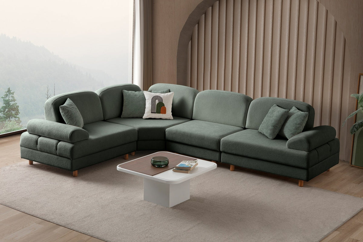 Grünes Eck-Schlafsofa Aries Modular M von Hanah Home mit Coco-Boucle-Polyesterbezug, Holzbeinen und sechs Zierkissen im Wohnzimmer.