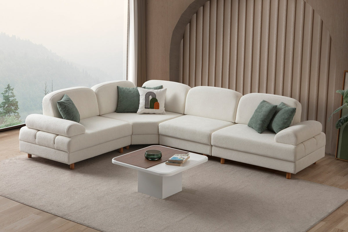 Weisses Eck-Schlafsofa Aries Modular M von Hanah Home mit Coco-Boucle-Stoff, Holzbeinen und Aufbewahrungstruhe, in L-Form.