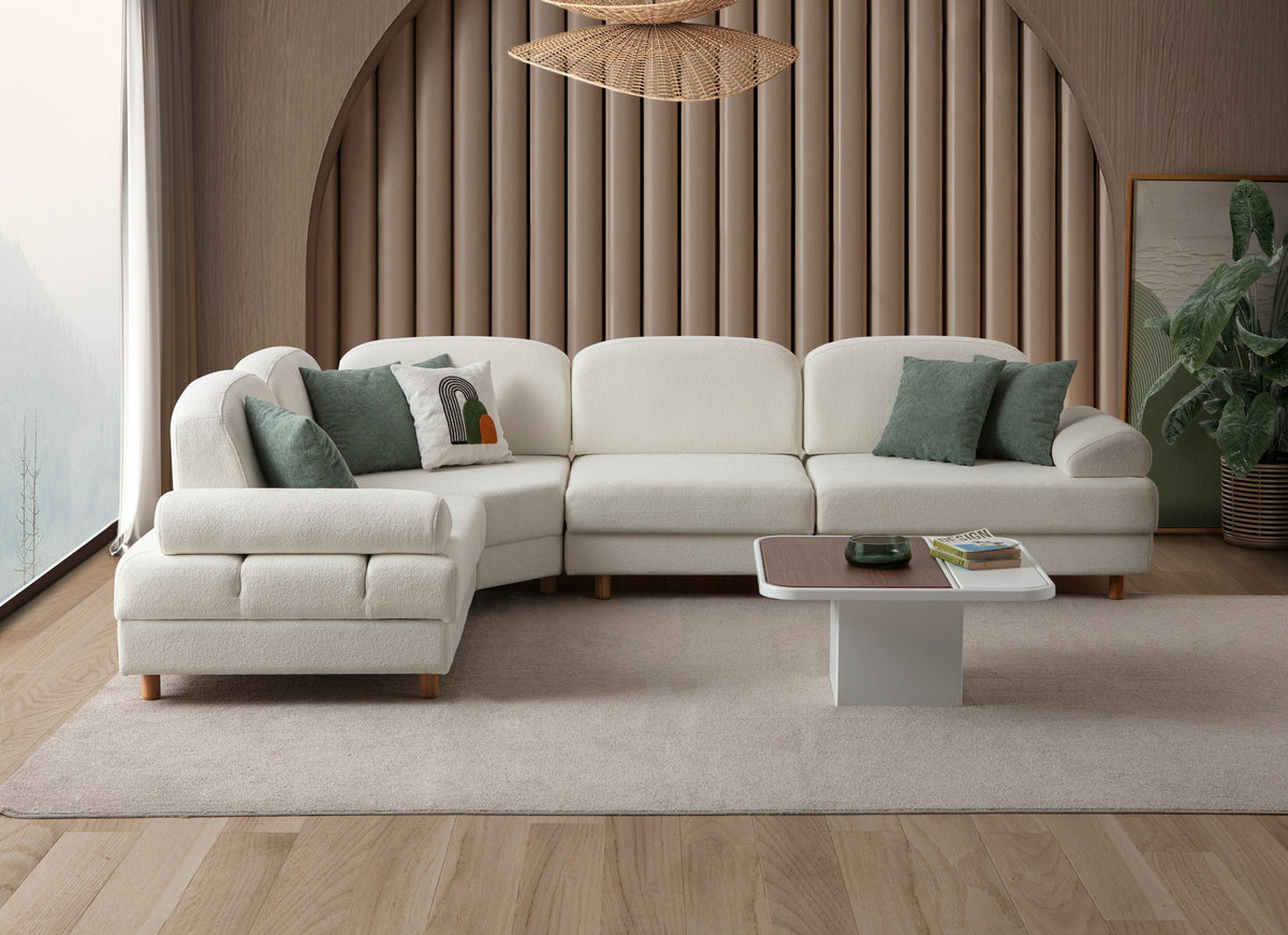 Weisses Eck-Schlafsofa Aries Modular M von Hanah Home mit Coco-Boucle-Stoff, Holzbeinen und Aufbewahrungstruhe, in L-Form.