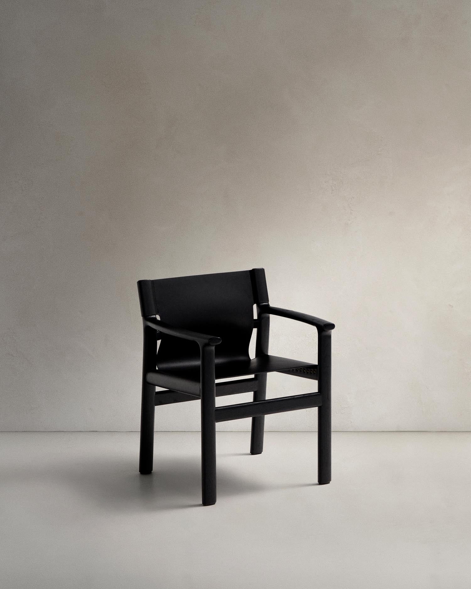 Chair Jan made of recycled leather fibers in black and solid ash wood FSC 100 % with Schw