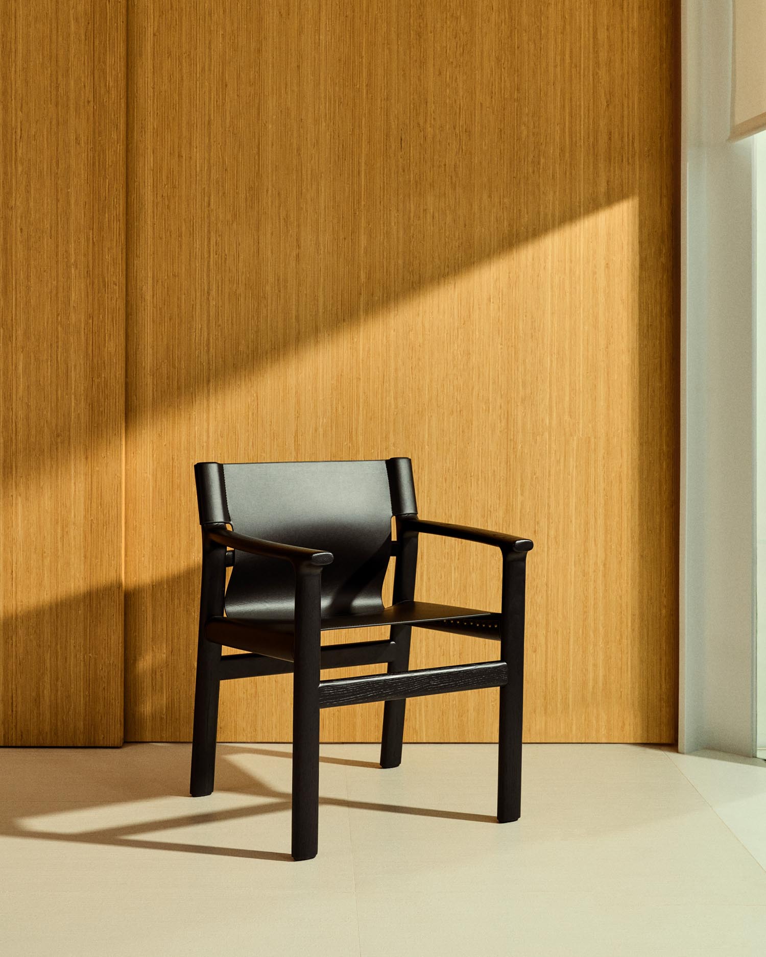 Chair Jan made of recycled leather fibers in black and solid ash wood FSC 100 % with Schw