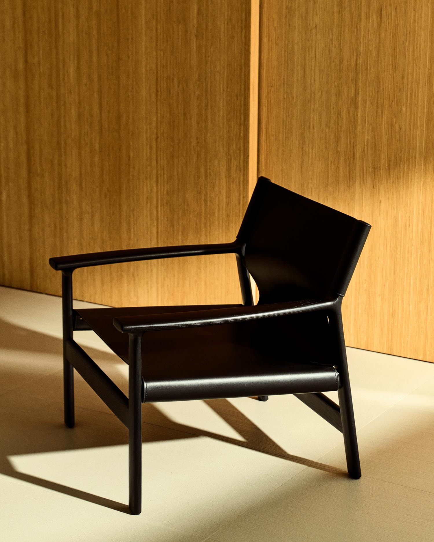 Armchair Jan made of recycled leather fibers in black and solid ash wood FSC 100 % with Sch