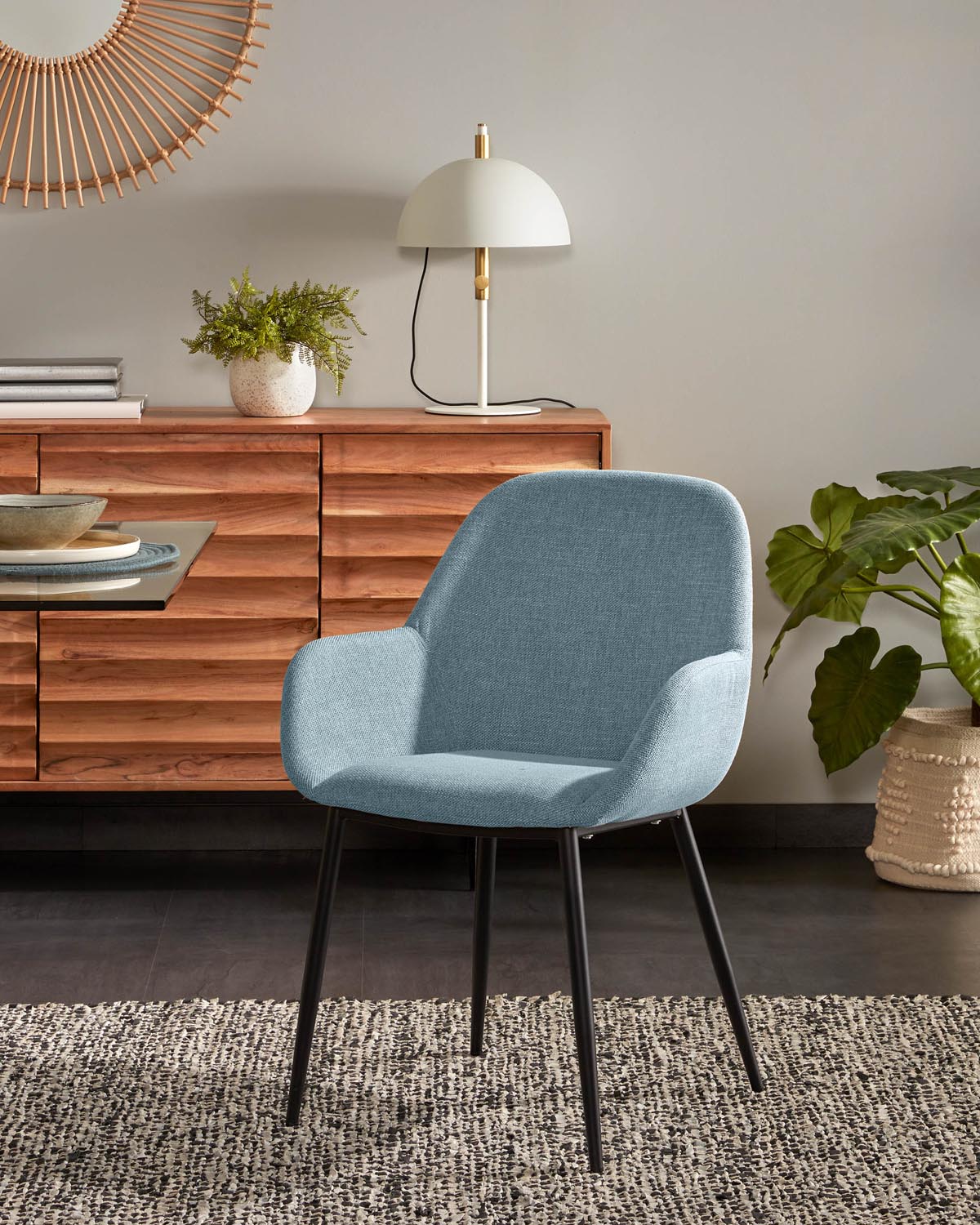 Konna chair in light blue with black lacquered steel legs