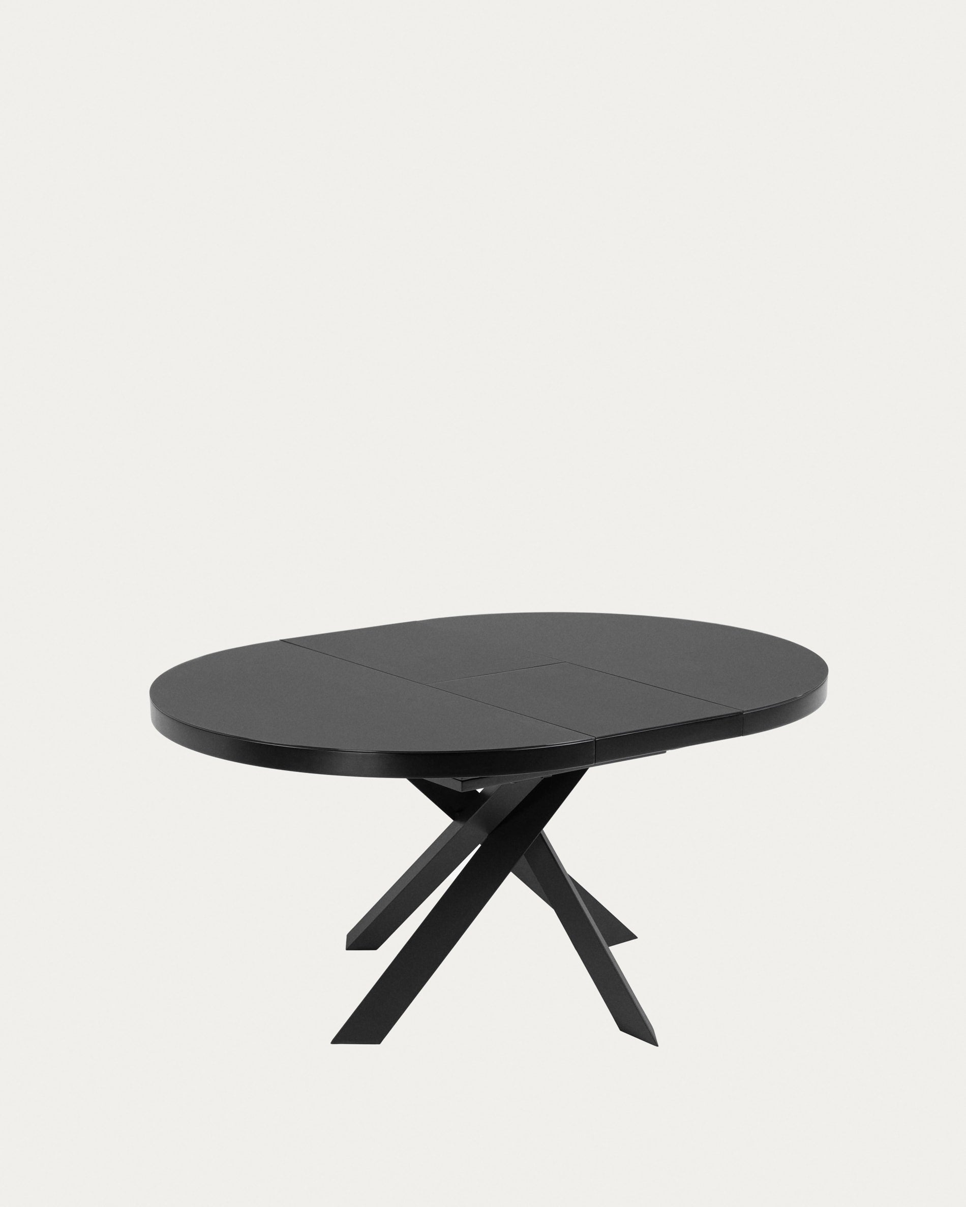 Eleganter runder Ausziehtisch mit Glasplatte und schwarzen Stahlbeinen, Ø 120-160 cm, perfekt für moderne Wohnräume.