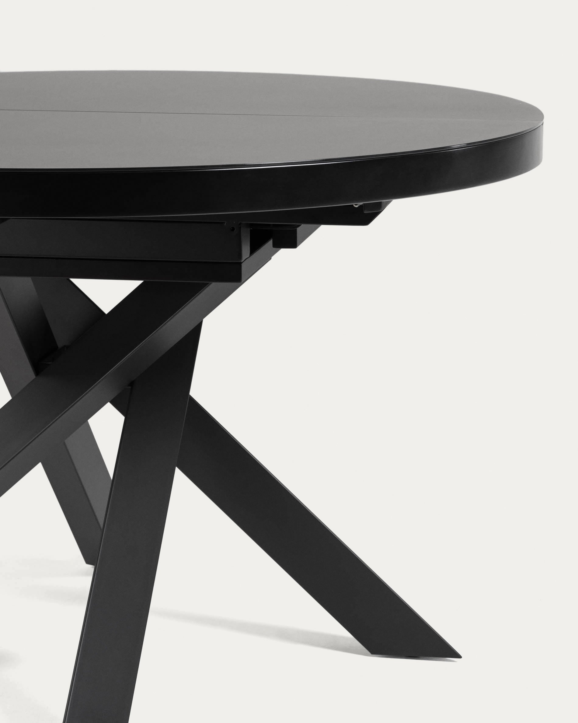 Moderner runder Ausziehtisch mit Glasplatte und schwarzen Stahlbeinen, Ø 120-160 cm, ideal für stilvolle Esszimmer.