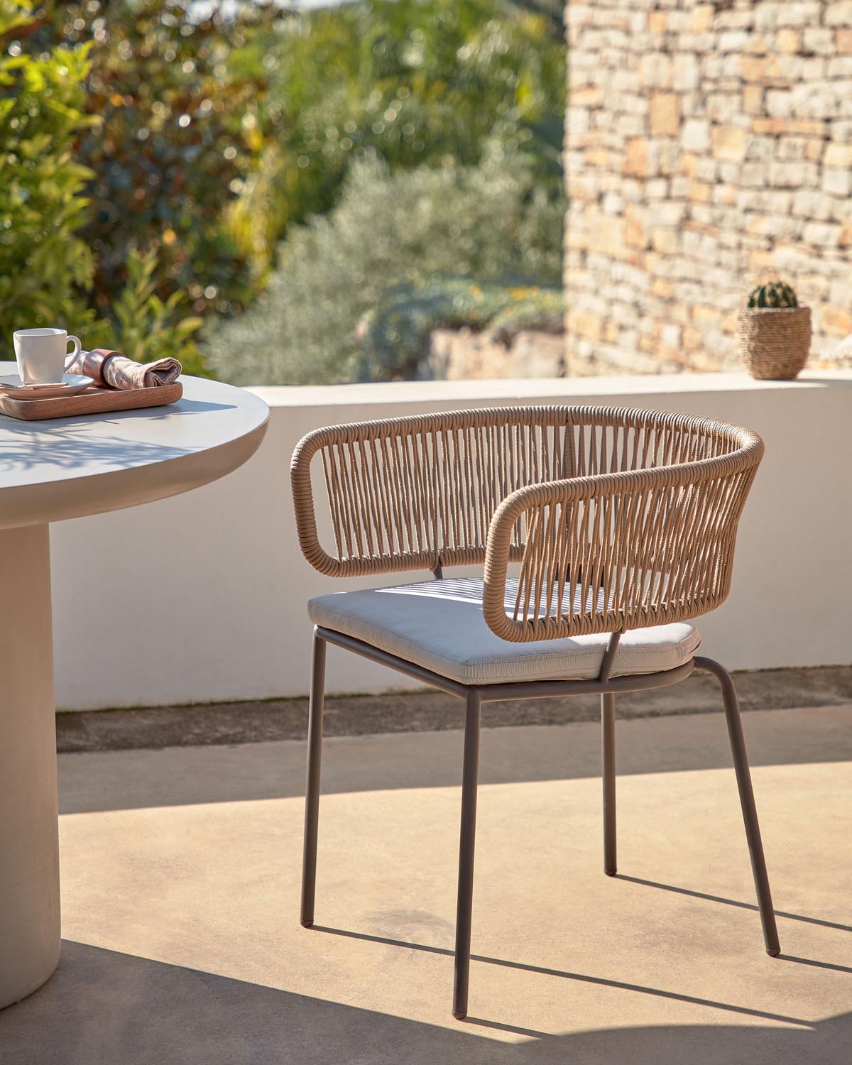 Nadin chair made of beige rope with galvanized steel legs