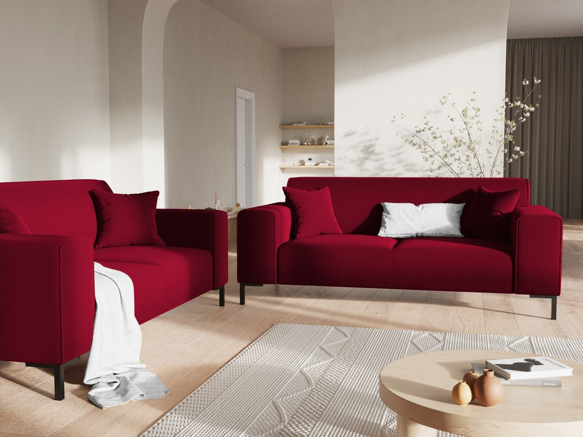 Zweisitzer-Sofa Siena in Beige-Salvador-Samt mit schwarzen Kunststoffbeinen, gepolsterter Sitzfläche und niedriger Rückenlehne, Frontansicht.