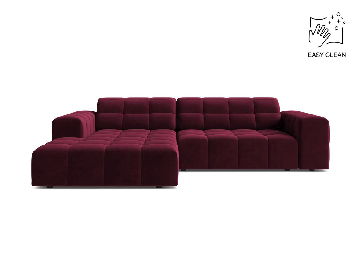 Ecksofa links Chicago in dunkelgrünem Samtstoff mit schwarzen Kunststoffbeinen, Massivholzrahmen und markanter Récamiere-Form.