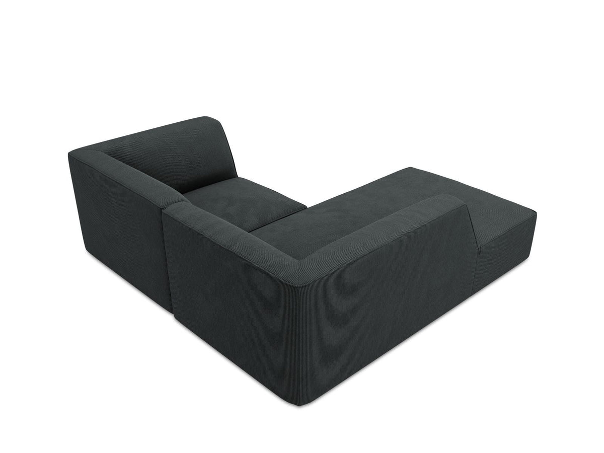 Modulares Ecksofa Siena mit gelbem Ottawa-Stoffbezug, schwarzen Kunststoffbeinen und Récamiere, Ansicht von vorne im Wohnraum.