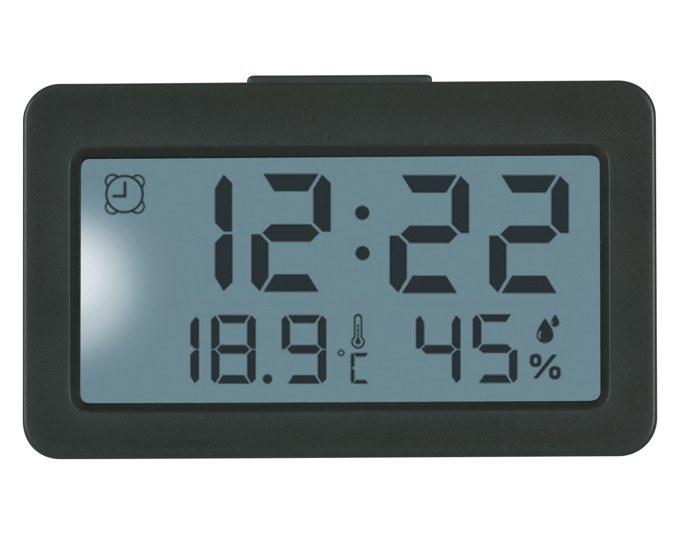 Digitaler TFA Mini-Wecker in Anthrazit mit Display für Uhrzeit, Innentemperatur und Luftfeuchtigkeit in kompakter, rechteckiger Bauform.