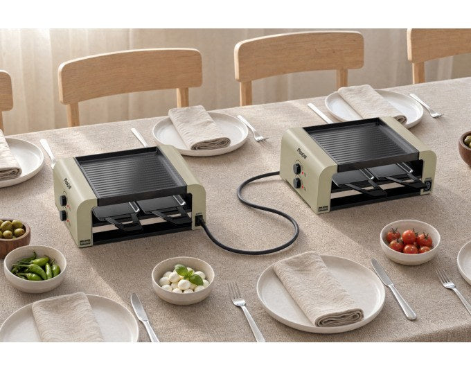 Tischgrill STÖCKLI PizzaGrill 4 Connect Set in Ivory Gold mit acht antihaftbeschichteten Pfännchen und wendbarer Aluguss-Grillplatte.