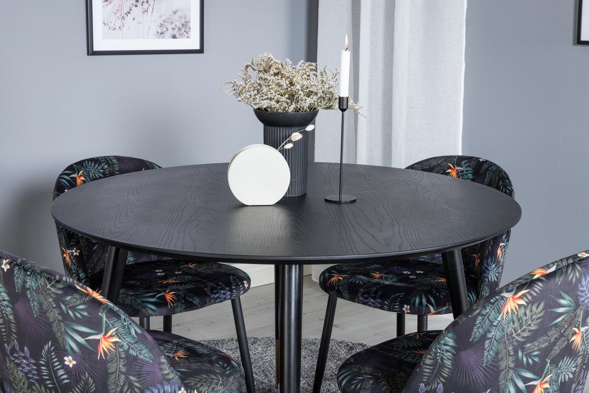 Rundes Dipp Esszimmerset: Esstisch ⌀115 cm mit schwarzem Furnier und schwarzen Beinen, dazu vier Velvet-Stühle mit schwarz-grauem Mikrofaserbezug.