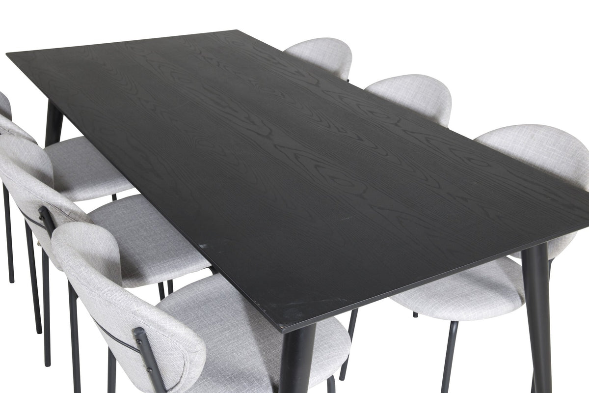 Schwarzes Esszimmerset Dipp mit Vault Stühlen: Tisch mit MDF-Furnierplatte und Stahlbeinen, Stühle mit Polsterbezug und Stahlgestell.