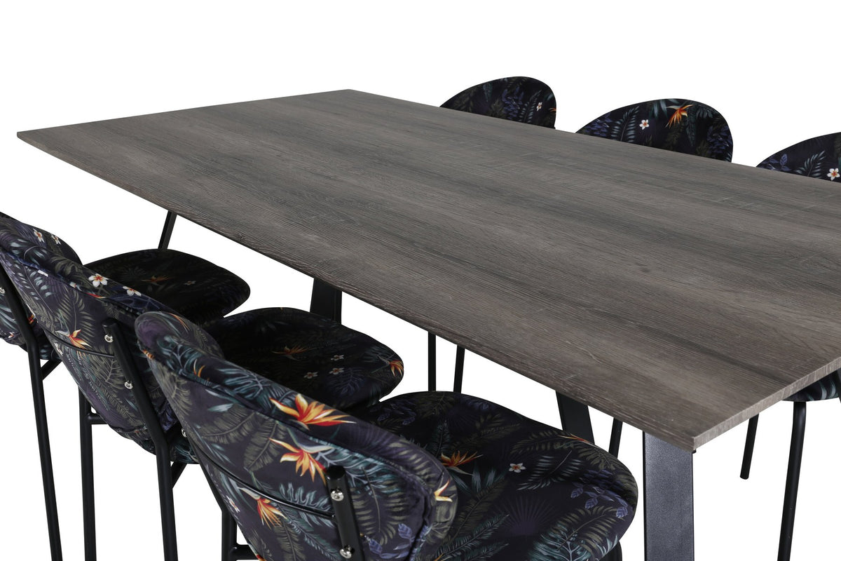 Esszimmerset Marina mit rechteckigem Tisch aus MDF und Papierlaminat sowie Stühlen mit Stahlgestell und Polyesterbezug in Grau.