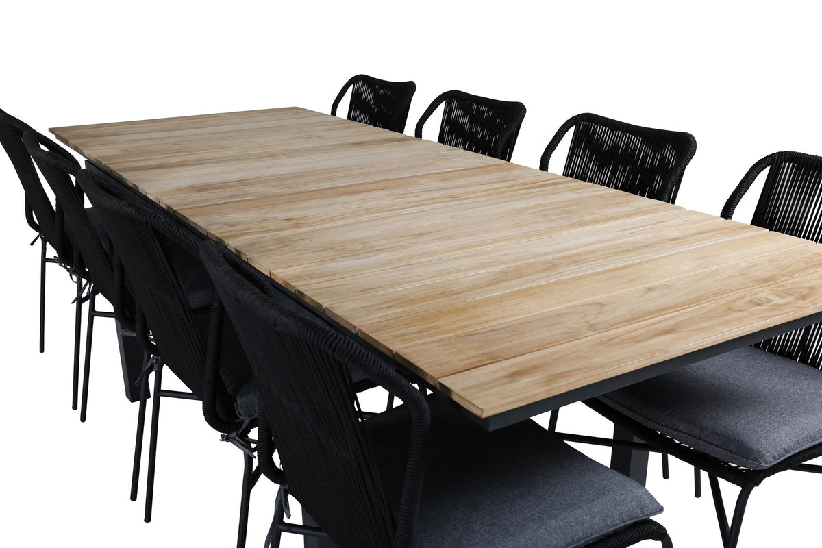 Vier schwarze Esszimmerstühle aus Aluminium mit Seilbezug und ausziehbarer rechteckiger Teakholz-Esstisch mit Stahlbeinen, Naturfarben.