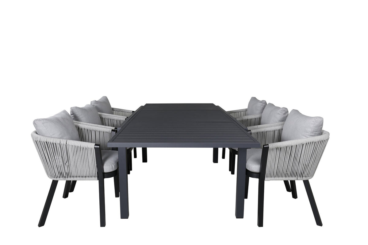 Gartentischset aus Aluminium: ausziehbarer Marbella Tisch mit schwarzem Gestell und 4 Virya Stühlen mit grauem Kissen im Aussenbereich.