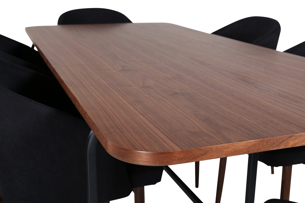 Esszimmerset Uno: rechteckiger Tisch mit MDF-Furnier-Platte in Nussbaum und schwarzem Stahlgestell, dazu Arch Stühle mit Polyesterbezug.