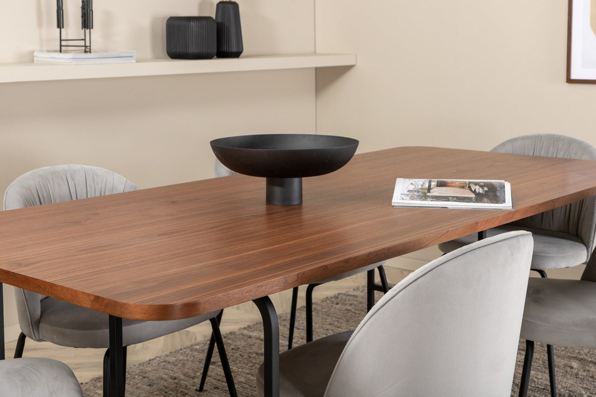 Esszimmerset Uno mit rechteckigem MDF-Tisch in Nussbaum-Furnier und schwarzem Stahlgestell, sechs Wrinkles Stühle mit grauem Samtbezug.
