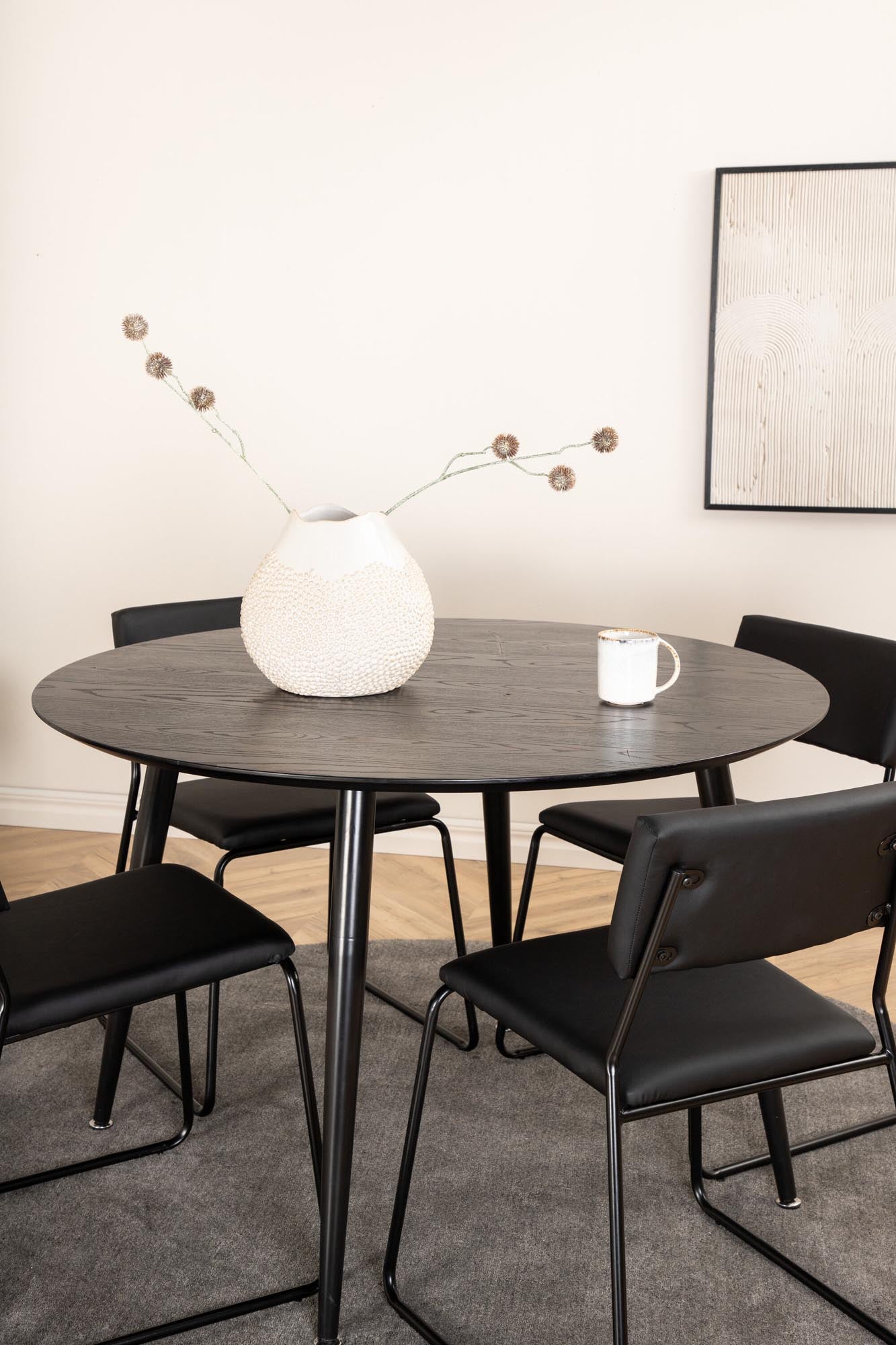 Stilvolles Dipp Esszimmerset von Venture Home: runder Tisch (115cm) und 4 elegante Stühle für gesellige Abende und modernes Wohnen.