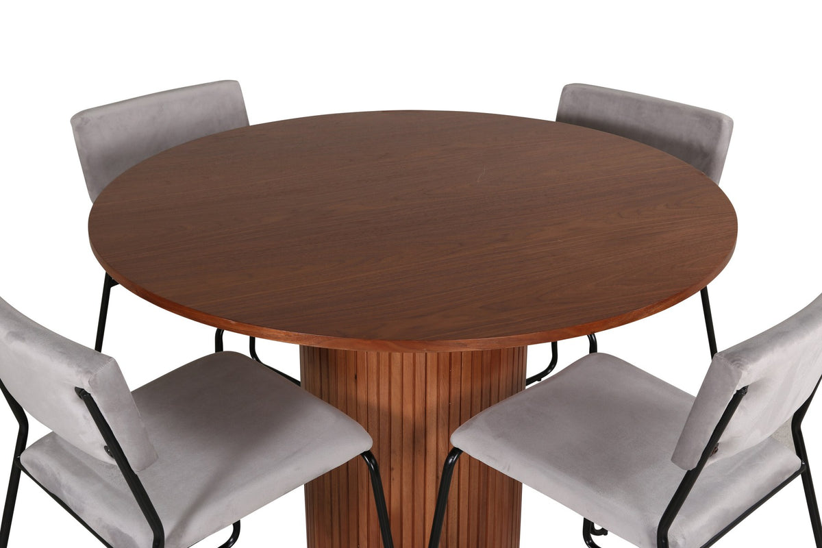 Zwei graue Esszimmerstühle mit schwarzem Metallgestell neben einem runden Esstisch aus Nussbaum-MDF mit Furnier, Durchmesser 110cm.