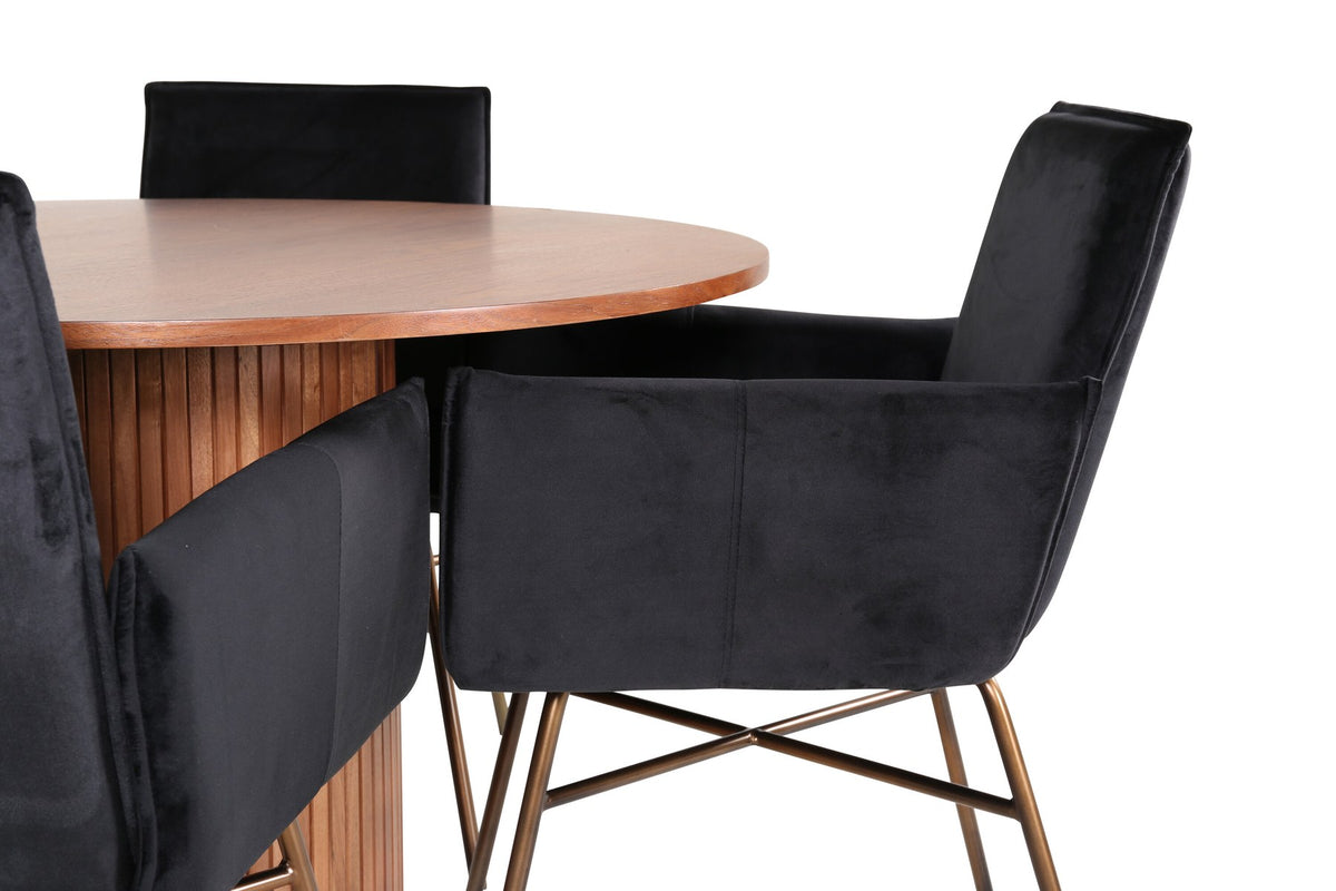 Rundes Esszimmerset mit Nussbaum-Tischplatte Ø110cm aus MDF und vier schwarzen Stühlen mit Samtsitz und Beinen aus Eisen.