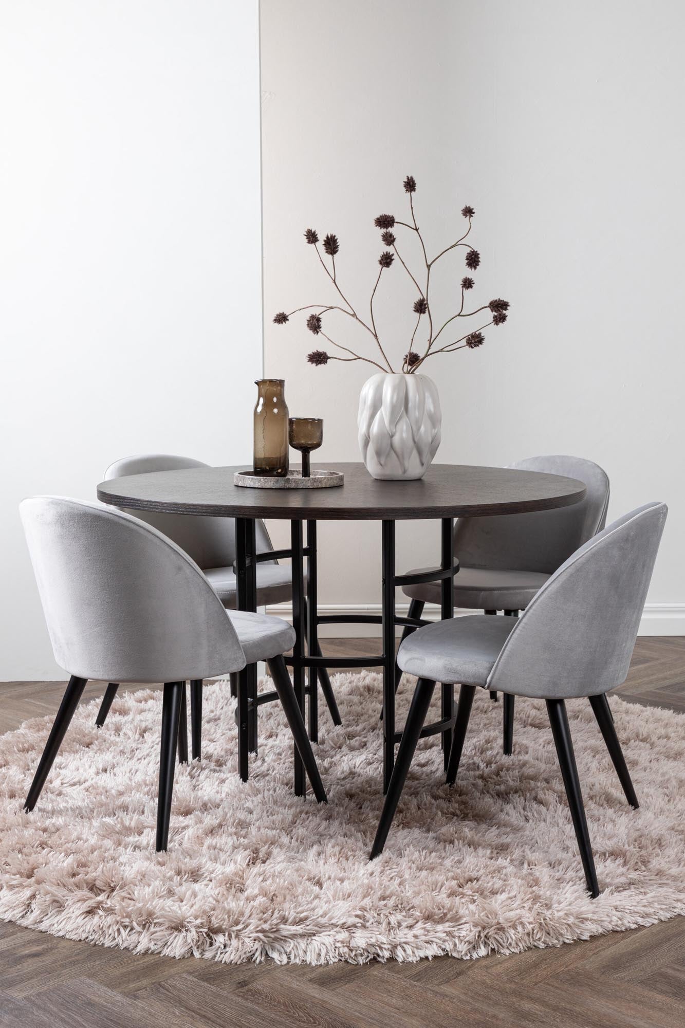 Esszimmerset Copenhagen + Velvet: Moderner runder Tisch mit robustem Metallgestell und stilvollen Samtstühlen für gemütliche Abende und unvergessliche Momente.