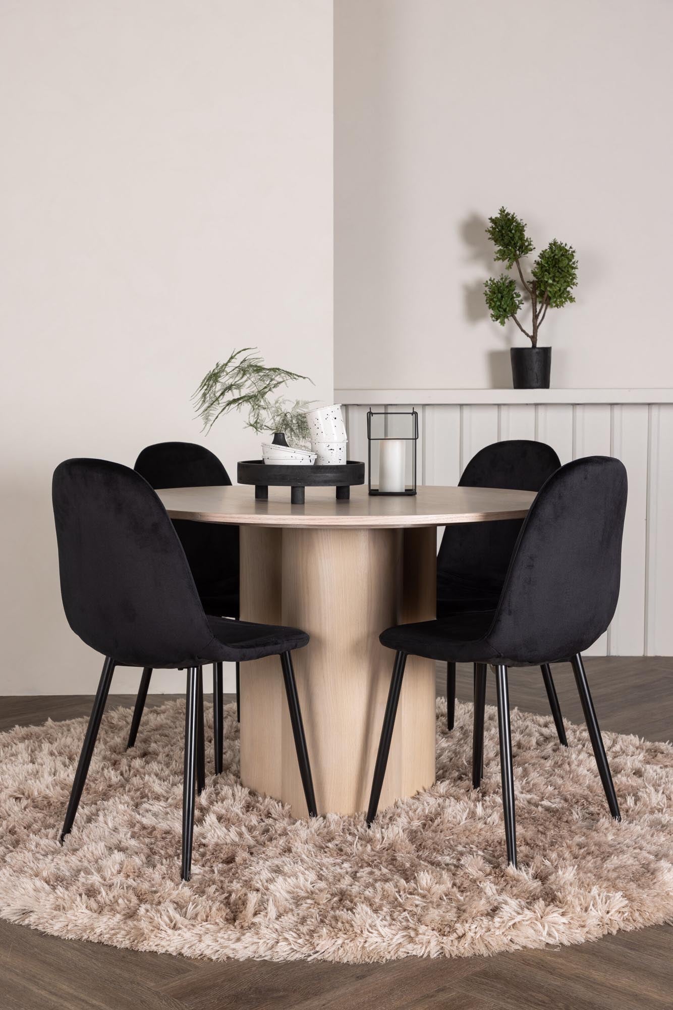 Stilvolles Olivia Esszimmer Set mit rundem Polar Tisch und 4 bequemen Samt-Stühlen. Perfekt für gesellige Abende und elegantes Ambiente.